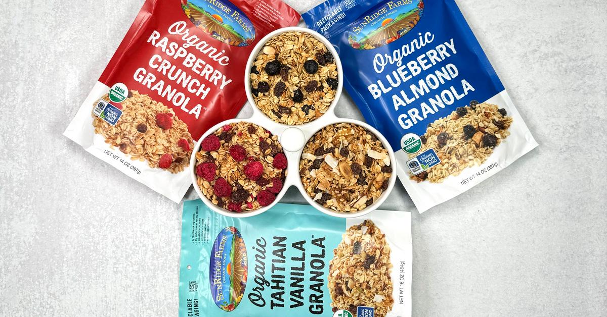 Three bags of SunRidge Farms granola on table with the granolas in three connected bowls